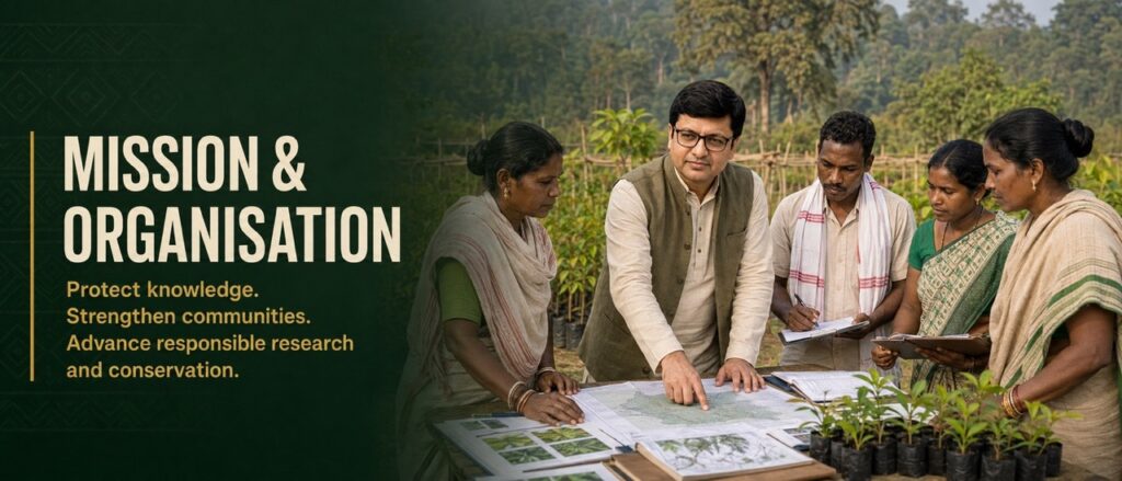 Environmentalist Rajeev Singh collaborating with Adivasi community members to review maps and documents, outlining the mission and organization of Hodopathy in Jharkhand.